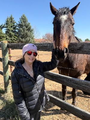 A beautiful woman, her fight, and her four-legged friend. Nothing like carrot dates and quiet strength