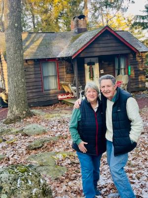 Dad and Mom on their 50th Wedding Anniversary infront of the cottage they stayed at on their Honeymoon in the Poconos